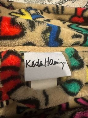 Ripple Junction Beige Plush Blanket with Red Blue Yellow and Teal Accents